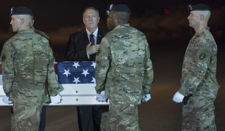 An Army carry team moves a transfer case containing the remains of Sgt. 1st Class Elis Barreto Ortiz, 34, from Morovis, Puerto Rico, past Secretary of State Mike Pompeo, Saturday, Sept. 7, 2019, at Dover Air Force Base, Del. According to the Department of Defense, Ortiz was killed in action Sept. 5, when a vehicle-borne improvised explosive device detonated near his vehicle in Kabul, Afghanistan. Ortiz was supporting Operation Freedom&#39;s Sentinel. (AP Photo/Cliff Owen)