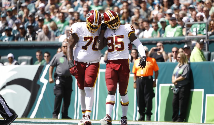 Washington Redskins' Vernon Davis, right, and Morgan Moses celebrate after Davis' touchdown during the first half of an NFL football game against the Philadelphia Eagles, Sunday, Sept. 8, 2019, in Philadelphia. (AP Photo/Matt Rourke)