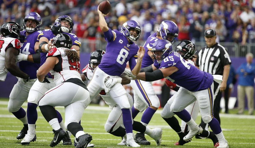 Minnesota Vikings quarterback Kirk Cousins throws a pass during the first half of an NFL football game against the Atlanta Falcons, Sunday, Sept. 8, 2019, in Minneapolis. (AP Photo/Bruce Kluckhohn)