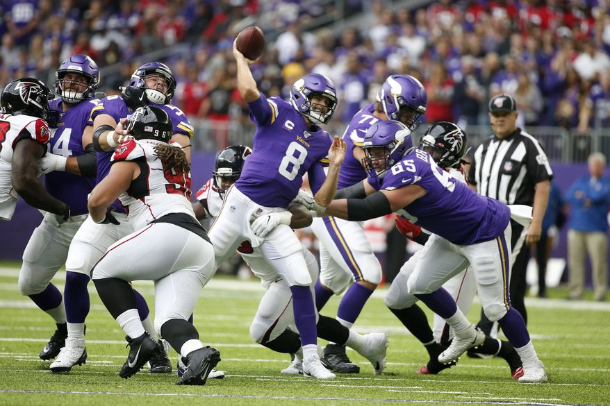 Minnesota Vikings quarterback Kirk Cousins throws a pass during the first half of an NFL football game against the Atlanta Falcons, Sunday, Sept. 8, 2019, in Minneapolis. (AP Photo/Bruce Kluckhohn)