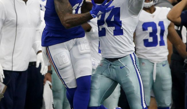 New York Giants wide receiver Cody Latimer (12) catches a pass in front of Dallas Cowboys cornerback Chidobe Awuzie (24) in the second half of a NFL football game in Arlington, Texas, Sunday, Sept. 8, 2019. (AP Photo/Michael Ainsworth)