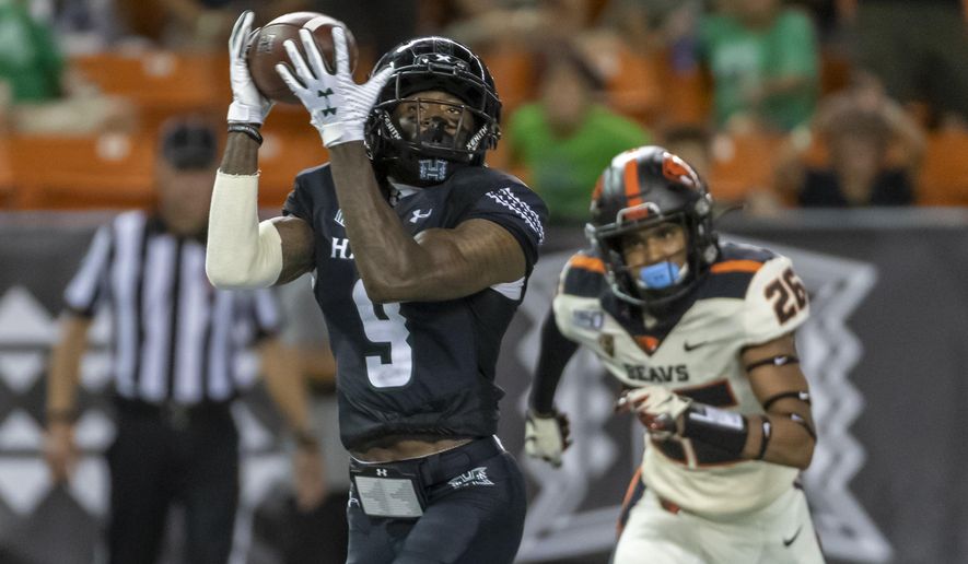 Hawaii wide receiver JoJo Ward (9) catches a pass for a touchdown while being defended by Oregon State defensive back Jojo Forest (26) during the second half of an NCAA college football game, Saturday, Sept. 7, 2019, in Honolulu. (AP Photo/Eugene Tanner)