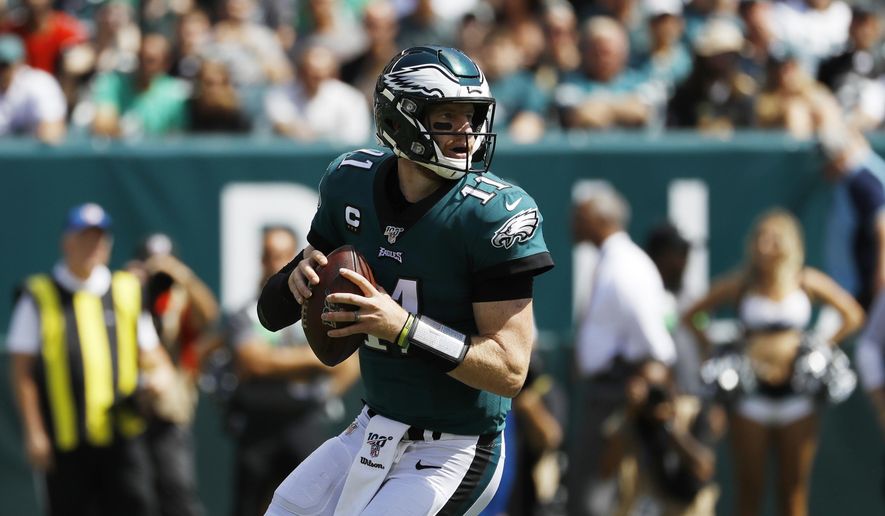 Philadelphia Eagles&#39; Carson Wentz looks to pass during the first half of an NFL football game against the Washington Redskins, Sunday, Sept. 8, 2019, in Philadelphia. (AP Photo/Michael Perez) **FILE**