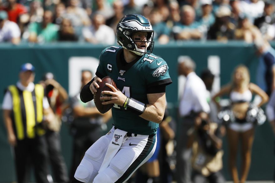 Philadelphia Eagles&#39; Carson Wentz looks to pass during the first half of an NFL football game against the Washington Redskins, Sunday, Sept. 8, 2019, in Philadelphia. (AP Photo/Michael Perez) **FILE**