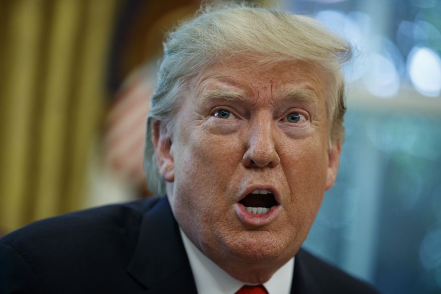 FILE - In this Sept. 4, 2019 file photo, President Donald Trump talks with reporters after receiving a briefing on Hurricane Dorian in the Oval Office of the White House in Washington. Trump targeted singer John Legend and his wife, model Chrissy Teigen following an MSNBC special on criminal justice reform which Legend appeared on. In a series of tweets late Sunday, Sept. 8 and early Monday, Sept. 9 Trump felt he wasn’t getting credit for a law he signed in late December that, among other things, reduces mandatory minimum sentences in some cases. Trump called Legend “boring” and said Teigen was “filthy mouthed.” He criticized them for not playing a role in the reform. (AP Photo/Evan Vucci, File )