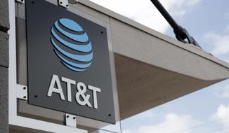 FILE - In this July 18, 2019, file photo, a sign is displayed at an AT&amp;amp;T retail store in Miami. Activist hedge fund manager Elliott Management is making a new $3.2 billion investment in AT&amp;amp;T, saying the company could be valued at more than $60 a share by 2021&#39;s end. AT&amp;amp;T stock jumped nearly 6% to $38.31 in Monday, Sept. 9, premarket trading. (AP Photo/Lynne Sladky, File)