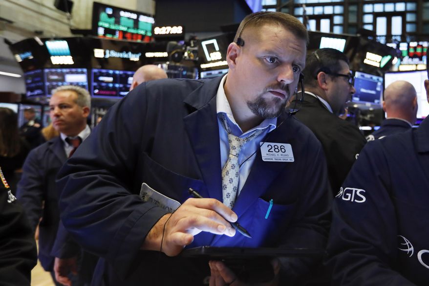 FILE - In this Sept. 4, 2019, file photo trader Michael Milano works on the floor of the New York Stock Exchange. The U.S. stock market opens at 9:30 a.m. EDT on Monday, Sept. 9. (AP Photo/Richard Drew, File)