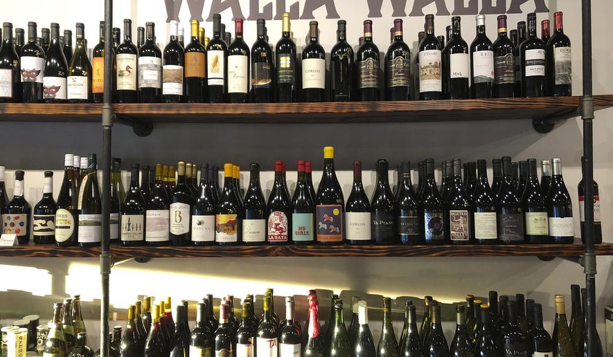 This Aug. 12, 2019 photo shows a selection of local wines at The Thief wine bar and bottle shop in Walla Walla, Wash. Southeastern Washington has been producing high-quality wines for decades. But in the past five years, the wineries of the Walla Walla Valley have drawn international accolades for the reds produced from the unique soil just across the border in Oregon. (AP Photo/Sally Carpenter Hale)