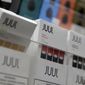 In this Dec. 20, 2018, file photo, Juul products are displayed at a smoke shop in New York. (AP Photo/Seth Wenig, File)