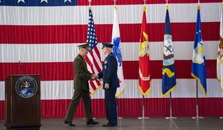 Then-Joint Chiefs of Staff Gen. Joseph F. Dunford Jr., left, shakes hands with Gen. John W. Raymond, the commander of the U.S. Space Command, Sept. 9, 2019, during a ceremony to recognize the establishment of the United States Space Command at Peterson Air Force Base in Colorado Springs, Colo.  (Christian Murdock/The Gazette via AP) ** FILE **