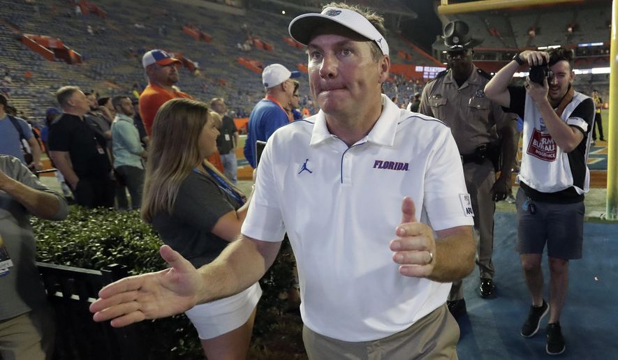 Florida head coach Dan Mullen acknowledges fans as he comes off the field after an NCAA college football game against UT Martin, Saturday, Sept. 7, 2019, in Gainesville, Fla. (AP Photo/John Raoux)