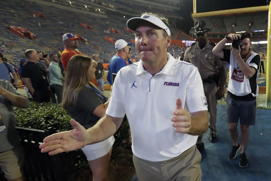 Florida head coach Dan Mullen acknowledges fans as he comes off the field after an NCAA college football game against UT Martin, Saturday, Sept. 7, 2019, in Gainesville, Fla. (AP Photo/John Raoux)