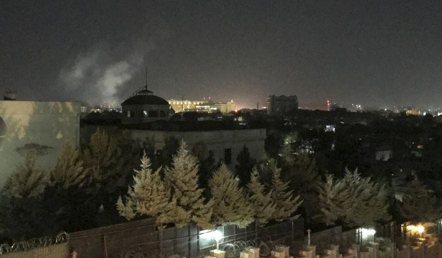 A plume of smoke rises near the U.S. Embassy in Kabul, Afghanistan on Wednesday, Sept. 11, 2019. A blast was heard shortly after midnight on the anniversary of the 9/11 attacks. (AP Photo/Cara Anna)