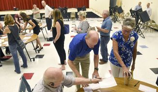 Precinct #74, at Alexander Graham Middle School, experienced a flurry of voters Tuesday, Sept. 10, 2019, as they cast their ballots in the party primaries and in the 9th District race between Dan Bishop and Dan McCready. (John D. Simmons/The Charlotte Observer via AP)