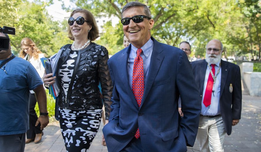 Michael Flynn, President Donald Trump&#x27;s former national security adviser, leaves the federal court with his lawyer Sidney Powell, left, following a status conference with Judge Emmet Sullivan, in Washington, Tuesday, Sept. 10, 2019. (AP Photo/Manuel Balce Ceneta)