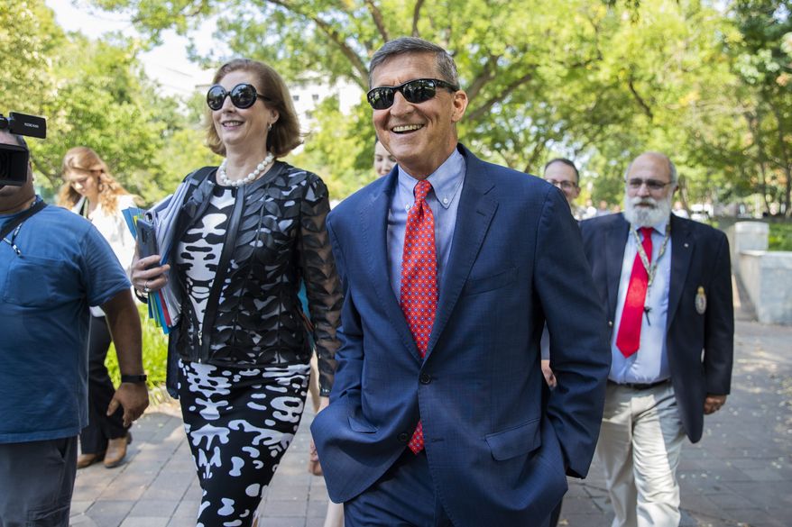 Michael Flynn, President Donald Trump&#x27;s former national security adviser, leaves the federal court with his lawyer Sidney Powell, left, following a status conference with Judge Emmet Sullivan, in Washington, Tuesday, Sept. 10, 2019. (AP Photo/Manuel Balce Ceneta)