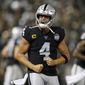 Oakland Raiders quarterback Derek Carr reacts after running back Josh Jacobs scored a touchdown during the fourth quarter of an NFL football game against the Denver Broncos Monday, Sept. 9, 2019, in Oakland, Calif. (AP Photo/D. Ross Cameron)