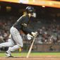 Pittsburgh Pirates&#39; Bryan Reynolds hits a RBI single for the go-ahead run against the San Francisco Giants in the ninth inning of a baseball game in San Francisco, Monday, Sept. 9, 2019. (AP Photo/John Hefti)