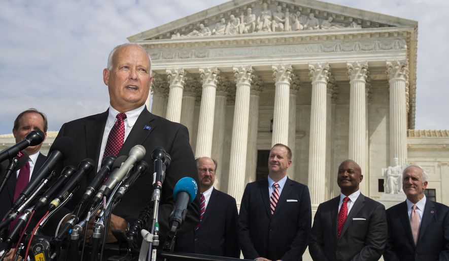 Nebraska Attorney General Doug Peterson with a bipartisan group of state attorneys general speaks to reporters in front of the U.S. Supreme Court in Washington, Monday, Sept. 9, 2019. A bipartisan coalition of 48 states along with Puerto Rico and the District of Columbia said Monday it is investigating whether Google's search and advertising business is engaged in monopolistic behavior. It follows a Friday announcement of a similar multistate probe targeting Facebook. (AP Photo/Manuel Balce Ceneta)