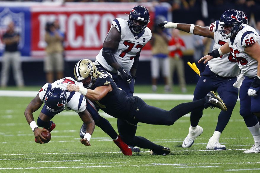 New Orleans Saints defensive end Trey Hendrickson (91) sacks Houston Texans quarterback Deshaun Watson (4) in the second half of an NFL football game in New Orleans, Monday, Sept. 9, 2019. (AP Photo/Butch Dill)