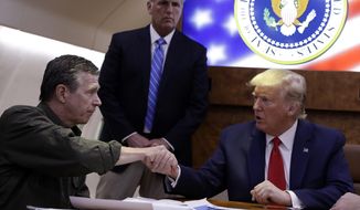President Donald Trump participates in a briefing with North Carolina Gov. Roy Cooper about Hurricane Dorian at Marine Corps Air Station Cherry Point, Monday, Sept. 9, 2019, in Havelock, N.C., aboard Air Force One. (AP Photo/Evan Vucci)