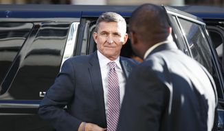 In this Dec. 18, 2018, file photo, President Donald Trump&#39;s former national security adviser, Michael Flynn, arrives at federal court in Washington. Flynn is due back in court for the first time in weeks as his lawyers mount an aggressive attack on the special counsel’s Russia investigation. (AP Photo/Carolyn Kaster, File)
