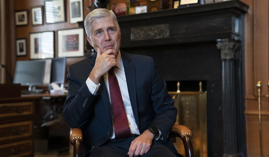 Associate Justice Neil Gorsuch, President Donald Trump&#39;s first appointee to the high court, speaks to The Associated Press about events that have influenced his life and the loss of civility in public discourse, in his chambers at the Supreme Court in Washington, Wednesday, Sept. 4, 2019. Gorsuch has written a new book on the importance of civics and civility, and a defense of his preferred originalism method of interpreting laws and the Constitution. (AP Photo/J. Scott Applewhite)