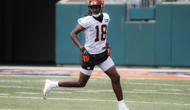 FILE - In this June 12, 2019, file photo, Cincinnati Bengals wide receiver A.J. Green participates during practice at the team&#x27;s NFL football facility in Cincinnati. A.J. Green has started running for the first time since he hurt his ankle during the opening practice of training camp, an indication he&#x27;s healing quickly from surgery. Green was out of his protective boot Wednesday, Sept. 11, 2019,  for the first time since the injury. The Bengals expect him back during the first half of the season, although there&#x27;s no specific target for his return. (AP Photo/John Minchillo, File)
