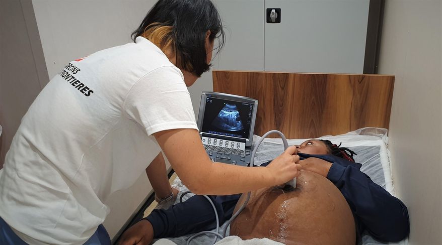 In this photo taken on Monday, Sept. 9, 2019, a pregnant woman undergoes ultrasound aboard a humanitarian ship in the Mediterranean Sea. A humanitarian rescue ship in the Mediterranean Sea has appealed to Italian and Maltese authorities for the medical evacuation of a pregnant woman and a safe place of disembarkation for the 83 other migrants on board. The Norwegian-flagged Ocean Viking, run jointly by SOS Mediterranee and Doctors Without Borders, rescued 50 migrants from a rubber boat on Sunday, including the woman who is 9 months pregnant. (Hannah Wallace Bowman/MSF via AP)