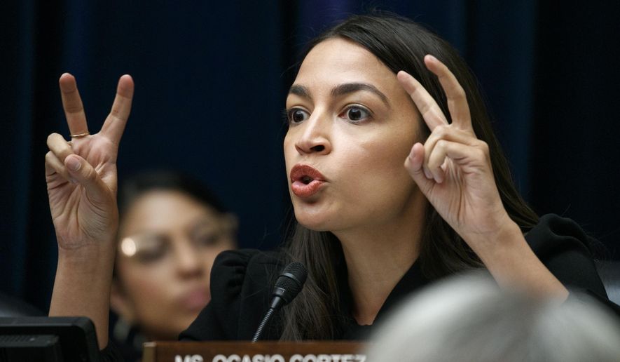 Rep. Alexandria Ocasio-Cortez, D-N.Y., asks a question during a House Oversight subcommittee hearing into the Trump administration&#x27;s decision to stop considering requests from immigrants seeking to remain in the country for medical treatment and other hardships, Wednesday, Sept. 11, 2019, in Washington. (AP Photo/Jacquelyn Martin)