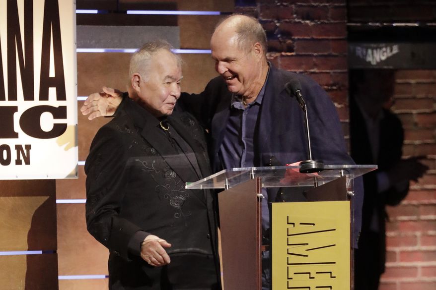 John Prine, left, and Pat McLaughlin accept the Song of the Year Award for "Summer's End" at the Americana Honors & Awards show Wednesday, Sept. 11, 2019, in Nashville, Tenn. (AP Photo/Wade Payne)