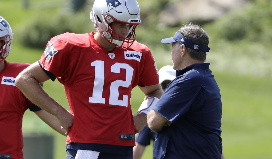 New England Patriots quarterback Tom Brady (12) speaks with head coach Bill Belichick, right, during NFL football practice, Wednesday, Sept. 11, 2019, in Foxborough, Mass. (AP Photo/Steven Senne)