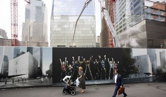 People walk by murals promoting the future site of the Ronald O. Perelman Performing Arts Center as cranes work over the site at the World Trade Center, Monday, Sept. 9, 2019 in New York. The arts building is one of the final pieces to be completed as part of the reconstruction of the World Trade Center. Wednesday marks the 18th anniversary of the attacks of Sept. 11, 2001. (AP Photo/Mark Lennihan)
