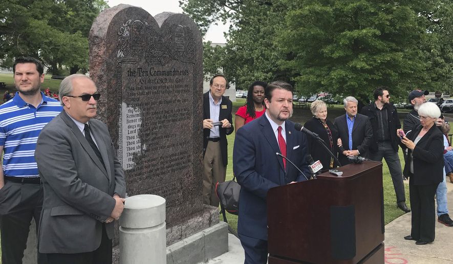FILE - In this April 26, 2018, file photo, Arkansas Republican state Sen. Jason Rapert speaks at the unveiling of a Ten Commandments monument outside the Arkansas state Capitol in Little Rock. An attorney for Rapert on Wednesday, Sept. 11, 2019, asked a federal judge to issue an order limiting the use of any deposition video in the lawsuit challenging the display's constitutionality.(AP Photo/Andrew DeMillo, File)