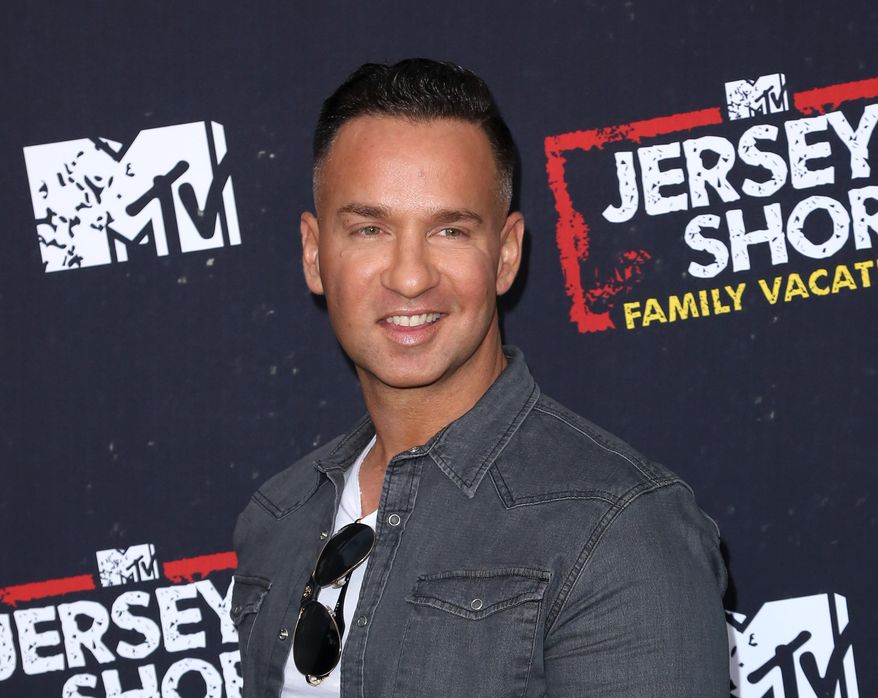 FILE - This March 29, 2018 file photo shows Mike "The Situation" Sorrentino at the premiere of "Jersey Shore Family Vacation" in Los Angeles. Sorrentino is scheduled to be released from prison in Otisville, New York, on Thursday, according to the Federal Bureau of Prison’s website. He and brother pleaded guilty last year to tax offenses related to nearly $9 million in income. (Photo by Willy Sanjuan/Invision/AP, File)