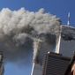 In this Sept. 11, 2001, file photo, smoke rises from the burning twin towers of the World Trade Center after hijacked planes crashed into the towers in New York City. (AP Photo/Richard Drew, File)