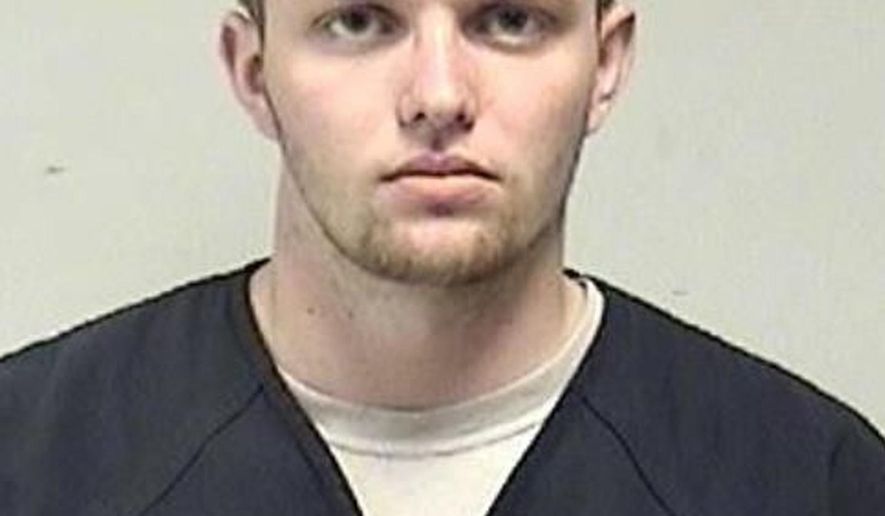 In this photo provided by the Kenosha County Sheriff's Office, Tyler Huffhines is pictured in a booking photo. Huffhines is accused of manufacturing thousands of counterfeit vaping cartridges a day with THC oil for almost two years, running the operation with 10 employees, authorities said. (Kenosha County Sheriff's Office via AP)