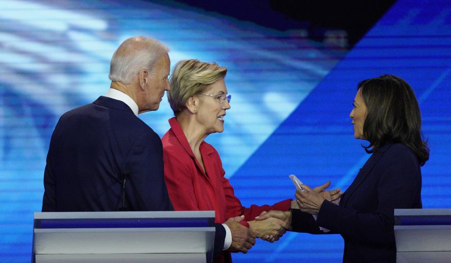 From left, Democratic presidential candidates former Vice President Joe Biden, Sen. Elizabeth Warren, D-Mass., and Sen. Kamala Harris, D-Calif., shake hands Thursday, Sept. 12, 2019, after a Democratic presidential primary debate hosted by ABC at Texas Southern University in Houston. (AP Photo/David J. Phillip)
