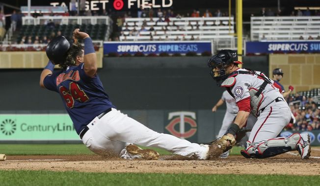 Washington Nationals catcher Yan Gomes, right, tags out Minnesota Twins&#x27; Willians Astudillo on a fielder&#x27;s choice at the plate in the second inning of a baseball game Thursday, Sept. 12, 2019, in Minneapolis. (AP Photo/Jim Mone) ** FILE **