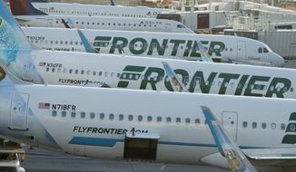 In this June 26, 2019 photo Frontier Airlines jetliners sit at gates on the A concourse at Denver International Airport in Denver. A new report says U.S. airlines are increasing their emissions of climate-changing gases much faster than they are boosting fuel efficiency. The International Council on Clean Transportation said Thursday, Sept. 12, 2019 that carbon dioxide emissions and fuel burning rose 7% from 2016 to 2018, overshadowing a 3% gain in fuel efficiency. The report ranked Frontier the most efficient among the 11 largest U.S. airlines. The Denver-based carrier has added more than 40 Airbus jets with more efficient engines. (AP Photo/David Zalubowski)
