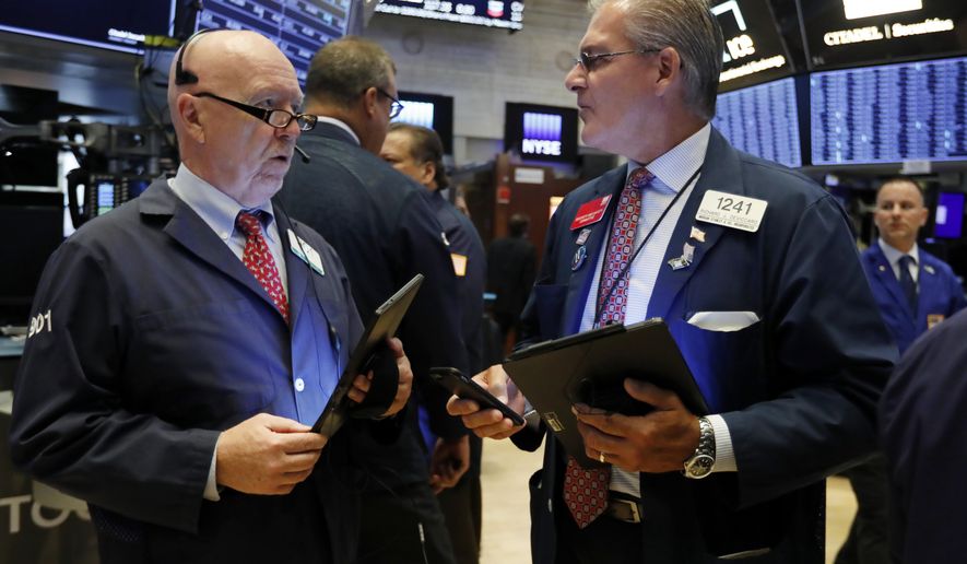 FILE - In this Sept. 4, 2019, file photo traders John Doyle, left, and Richard Deviccaro work on the floor of the New York Stock Exchange. The U.S. stock market opens at 9:30 a.m. EDT on Thursday, Sept. 12. (AP Photo/Richard Drew, File)