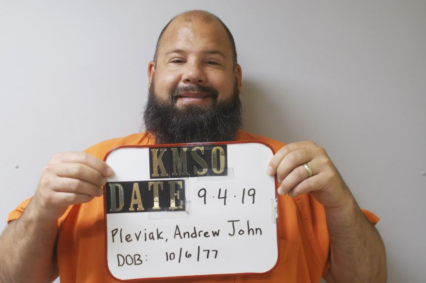 In this photo provided by the Kingman County Sheriff's Office, Andrew John Pleviak is pictured in a booking photo dated Sept. 4, 2019. Pleviak, a former agent with U.S. Immigration and Customs Enforcement, has been accused of impersonating an immigration officer during a foiled attempt to help an inmate escape from a local jail in Kansas. (Kingman County Sheriff's Office via AP)