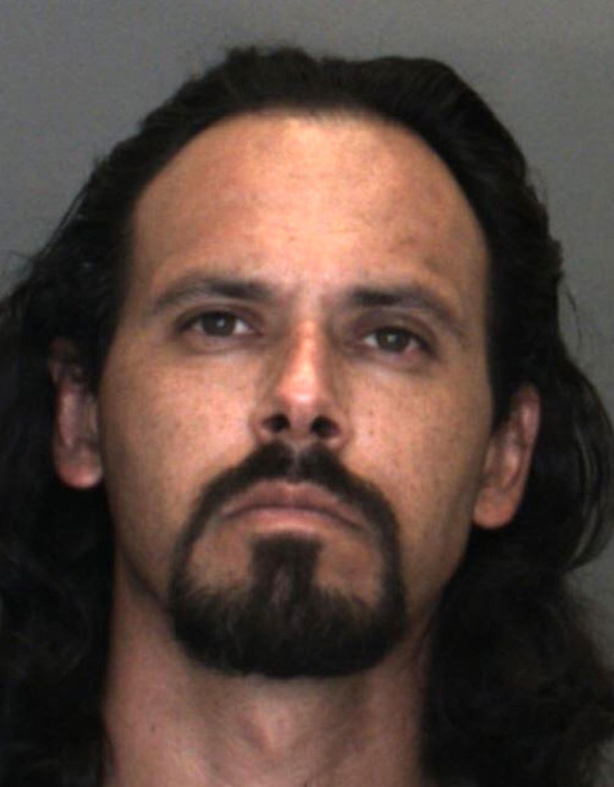 This undated booking photo released by the San Bernardino County, Calif., Sheriff's Office shows Phillip Williamson, whom authorities are seeking in connection with the slaying of a woman and two other people in inland Southern California. Authorities said Wednesday, Sept. 11, 2019 that Williamson, knew all three victims. The exact relationships were not disclosed. The department says the 37-year-old is at large and should be considered dangerous. (San Bernardino County Sheriff's Office via AP)