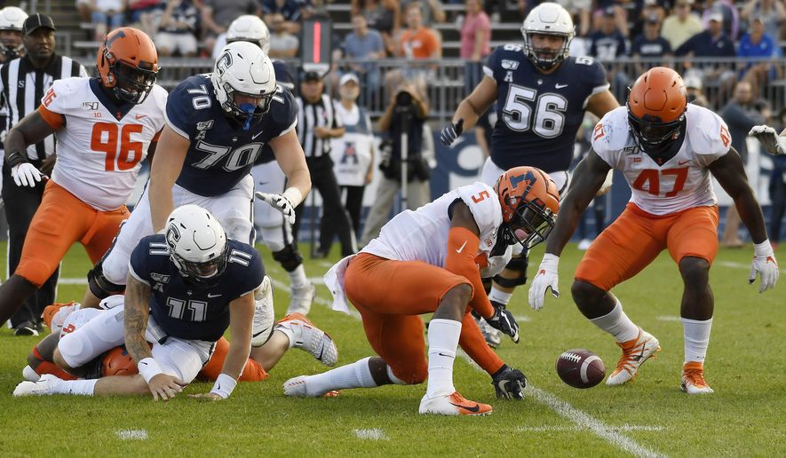 Illinois linebacker Milo Eifler (5) and Illinois defensive lineman Oluwole Betiku Jr. (47) reach to take possession of a ball fumbled by Connecticut quarterback Jack Zergiotis (11) during the second half of an NCAA college football game, Saturday, Sept. 7, 2019, in East Hartford, Conn. (AP Photo/Jessica Hill)