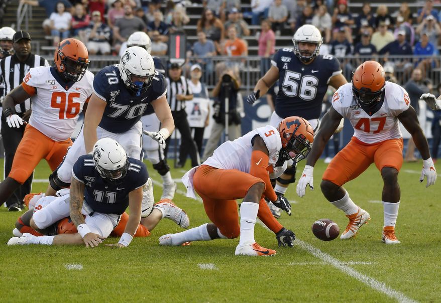 Illinois linebacker Milo Eifler (5) and Illinois defensive lineman Oluwole Betiku Jr. (47) reach to take possession of a ball fumbled by Connecticut quarterback Jack Zergiotis (11) during the second half of an NCAA college football game, Saturday, Sept. 7, 2019, in East Hartford, Conn. (AP Photo/Jessica Hill)