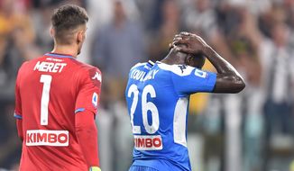Napoli&#39;s Kalidou Koulibaly reacts after scoring the own goal that gave Juventus a 4-3 win, during the Italian Serie A soccer match Juventus and  Napoli at the Allianz Stadium in Turin, Italy, Saturday Aug. 31, 2019. (Alessandro di Marco/ANSA via AP)