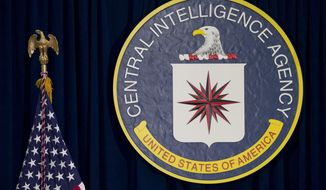 This April 13, 2016 file photo shows the seal of the Central Intelligence Agency at CIA headquarters in Langley, Va. (AP Photo/Carolyn Kaster, File)  **FILE**
