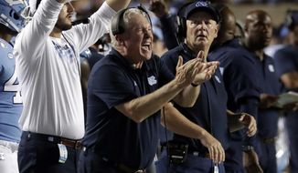 North Carolina coach Mack Brown cheers on his team during the fourth quarter of an NCAA college football game against Miami in Chapel, N.C., Saturday, Sept. 7, 2019. (AP Photo/Chris Seward)