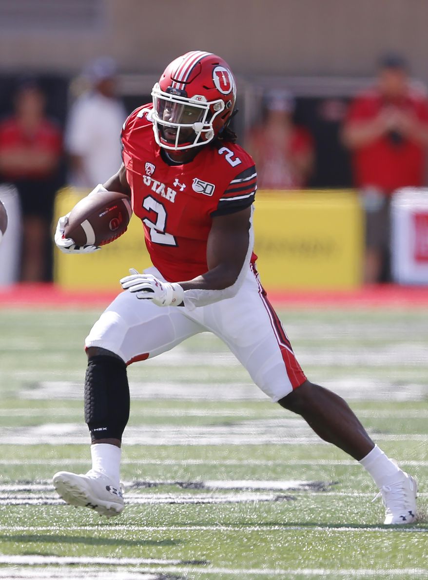 Utah running back Zack Moss (2) carries the ball against Northern Illinois in the first half of an NCAA college football game Saturday, Sept. 9, 2019, Salt Lake City. (AP Photo/Rick Bowmer)
