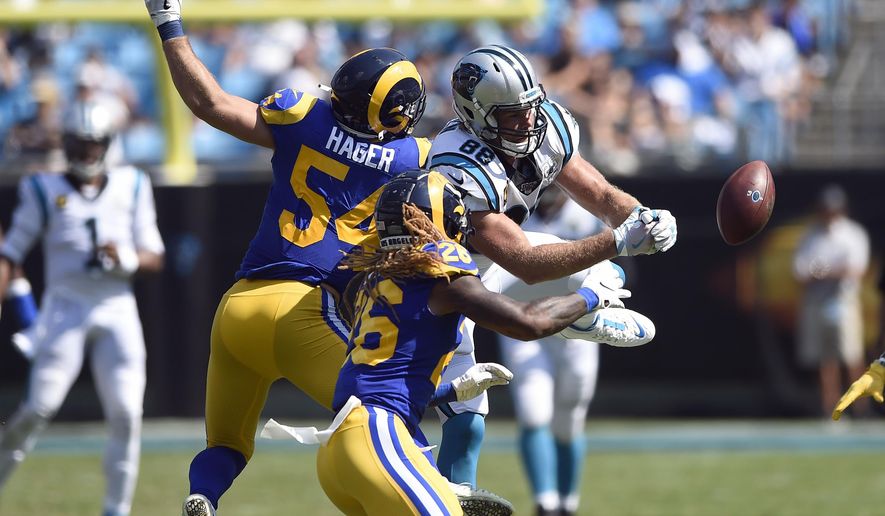Carolina Panthers tight end Greg Olsen (88) reaches for a pass against Los Angeles Rams linebacker Bryce Hager (54) and defensive back Marqui Christian (26) during the second half of an NFL football game in Charlotte, N.C., Sunday, Sept. 8, 2019. (AP Photo/Mike McCarn)